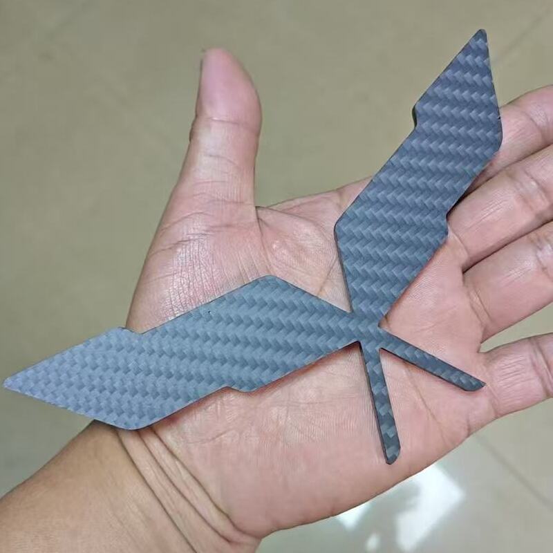 Handheld custom carbon fiber automotive emblem showing actual size.jpg